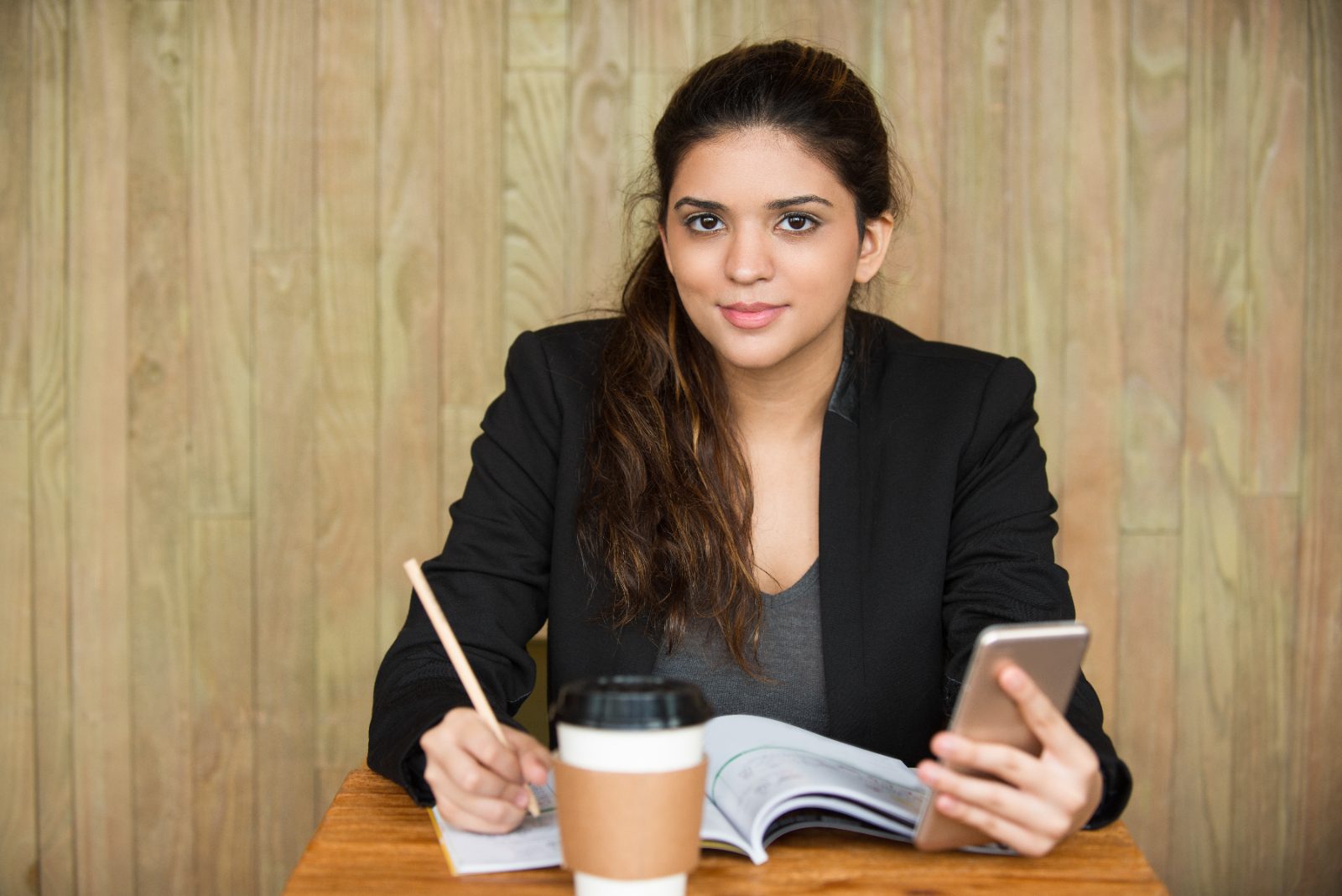 Young Indian woman professional in a blazer at work
