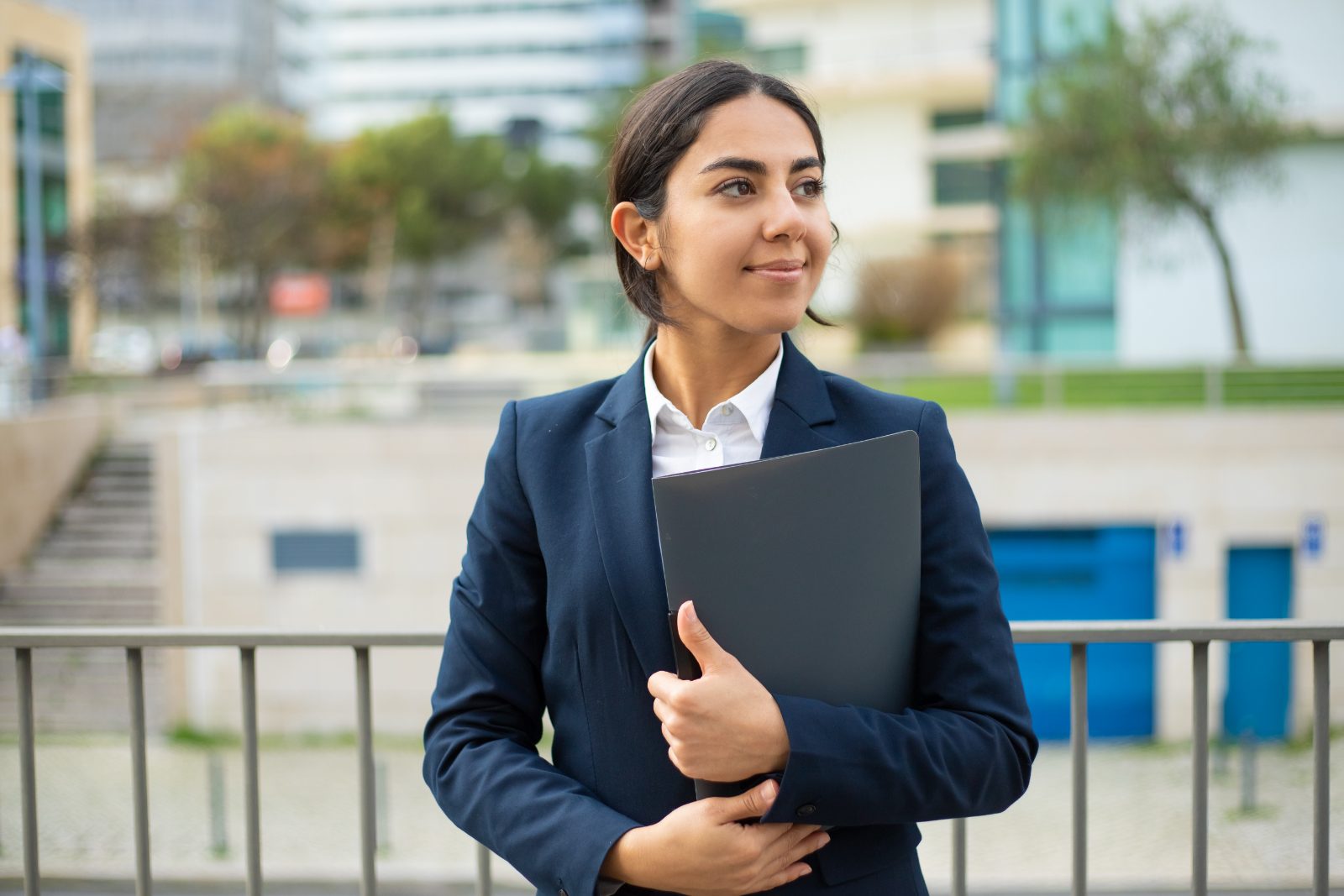 Young Indian businesswoman holding a folder