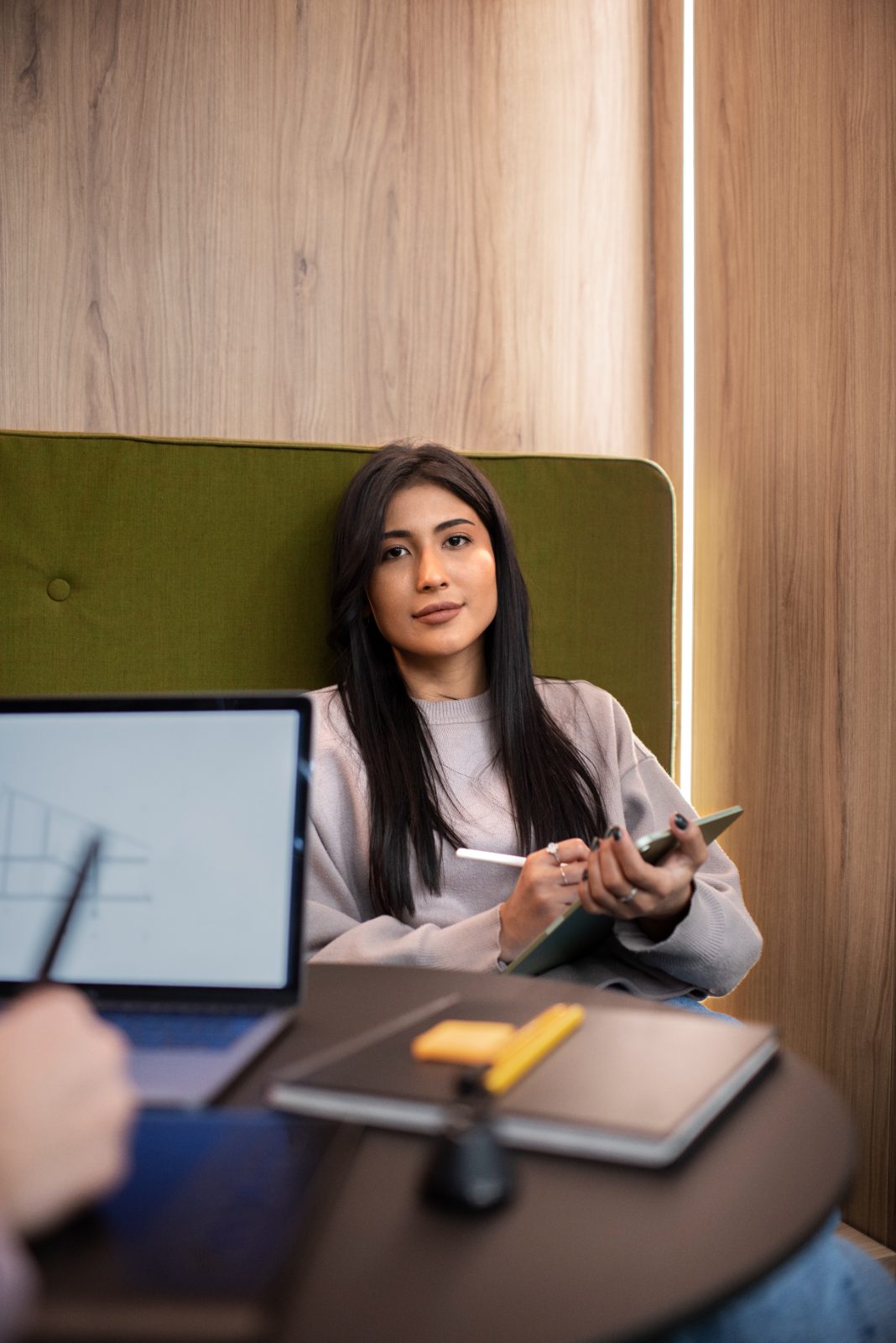 Young woman professional in a team meeting